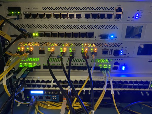 Various MikroTik routers in a rack